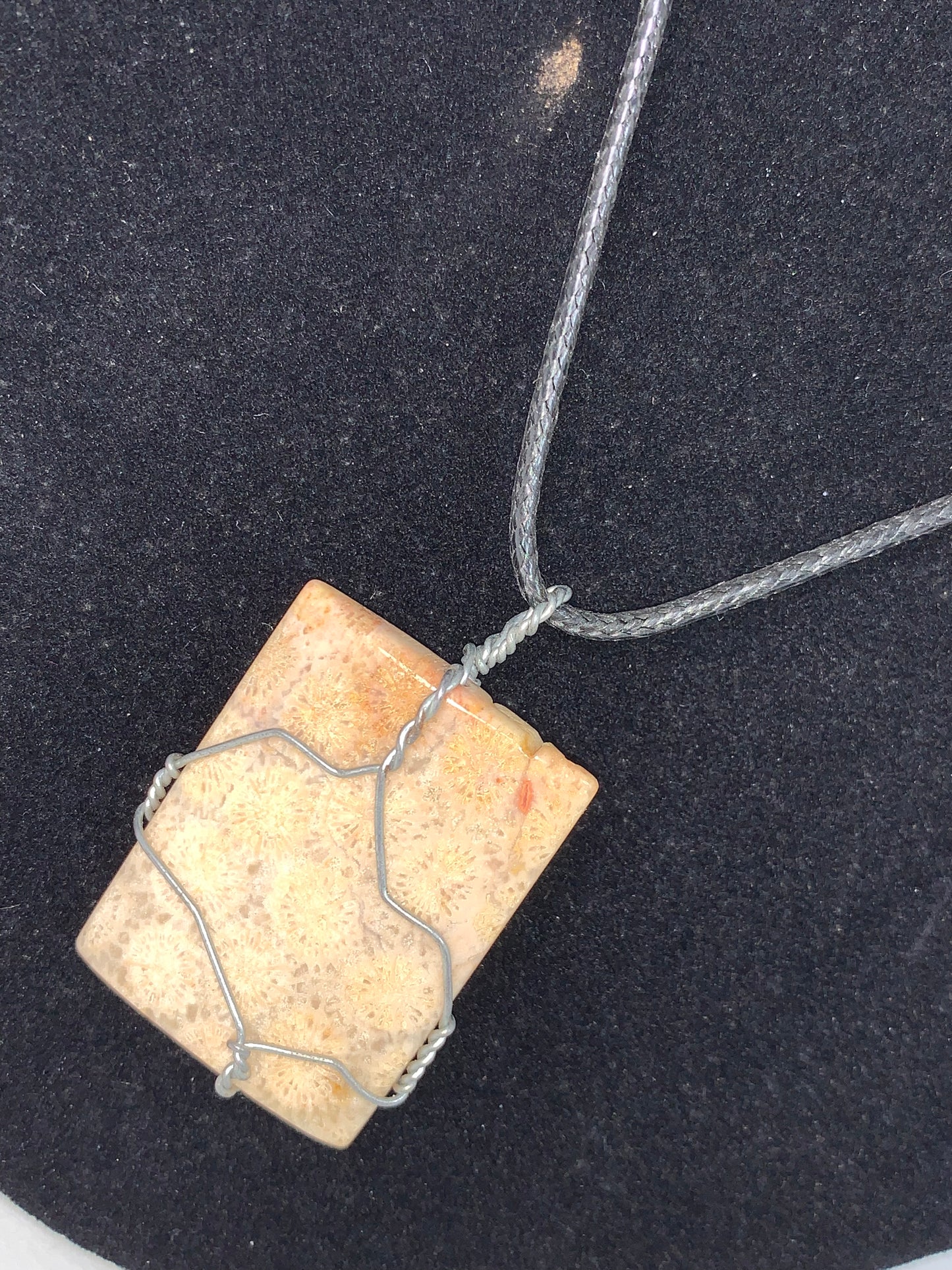 20" Braided Leather necklace with Wire wrapped Fossilized Coral Pendant