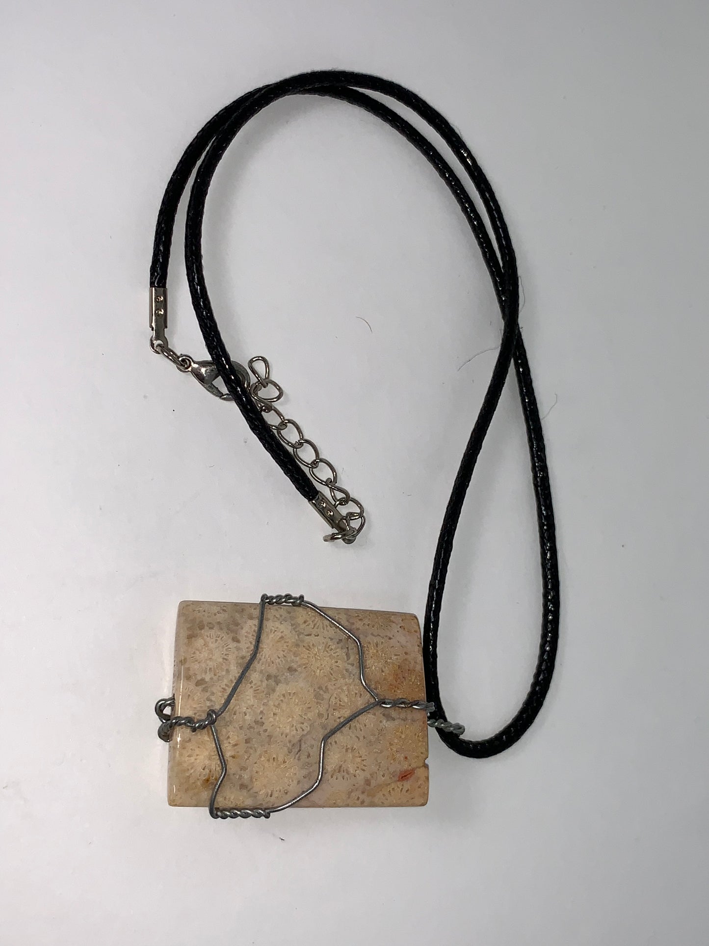 20" Braided Leather necklace with Wire wrapped Fossilized Coral Pendant