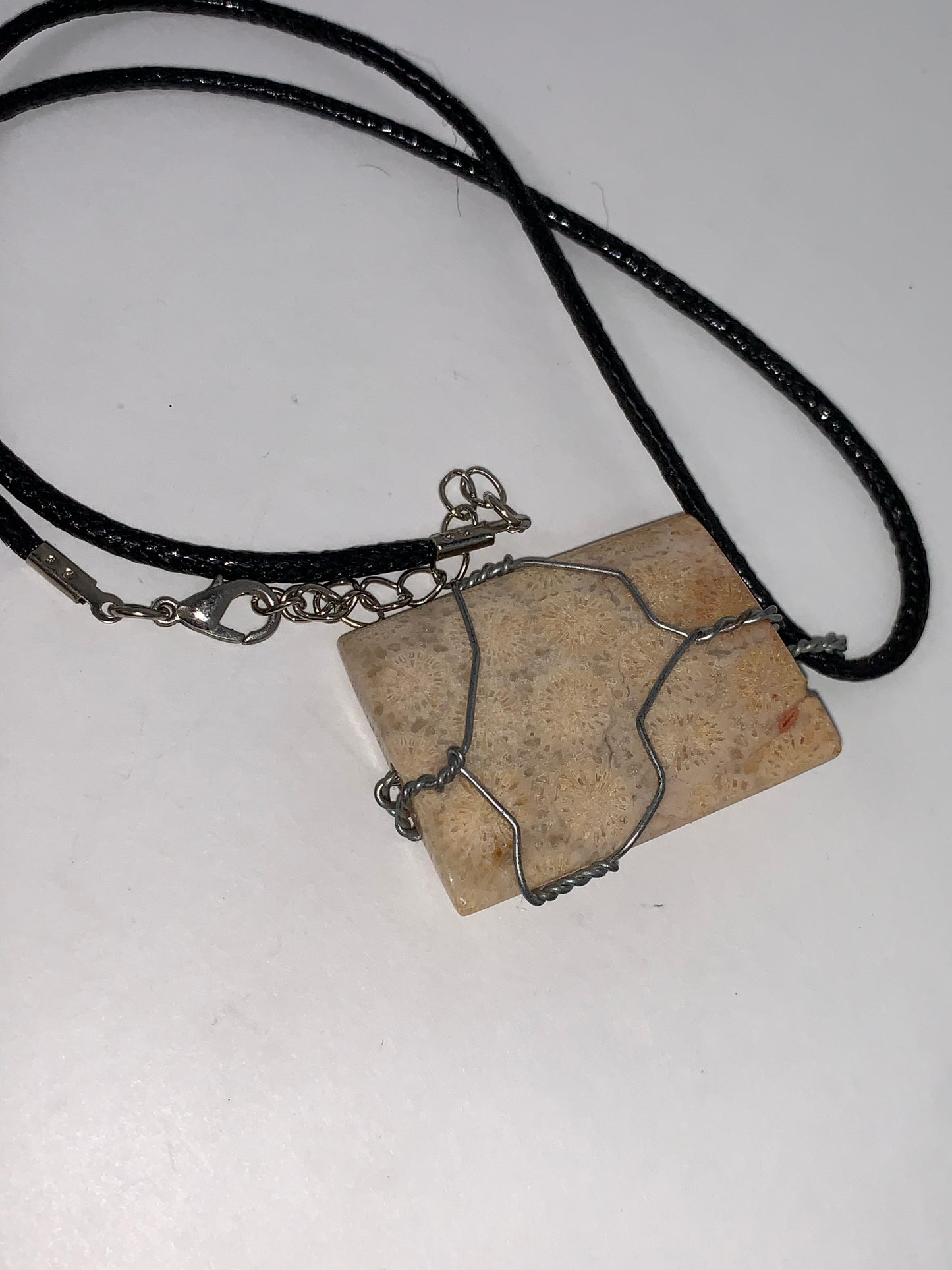 20" Braided Leather necklace with Wire wrapped Fossilized Coral Pendant
