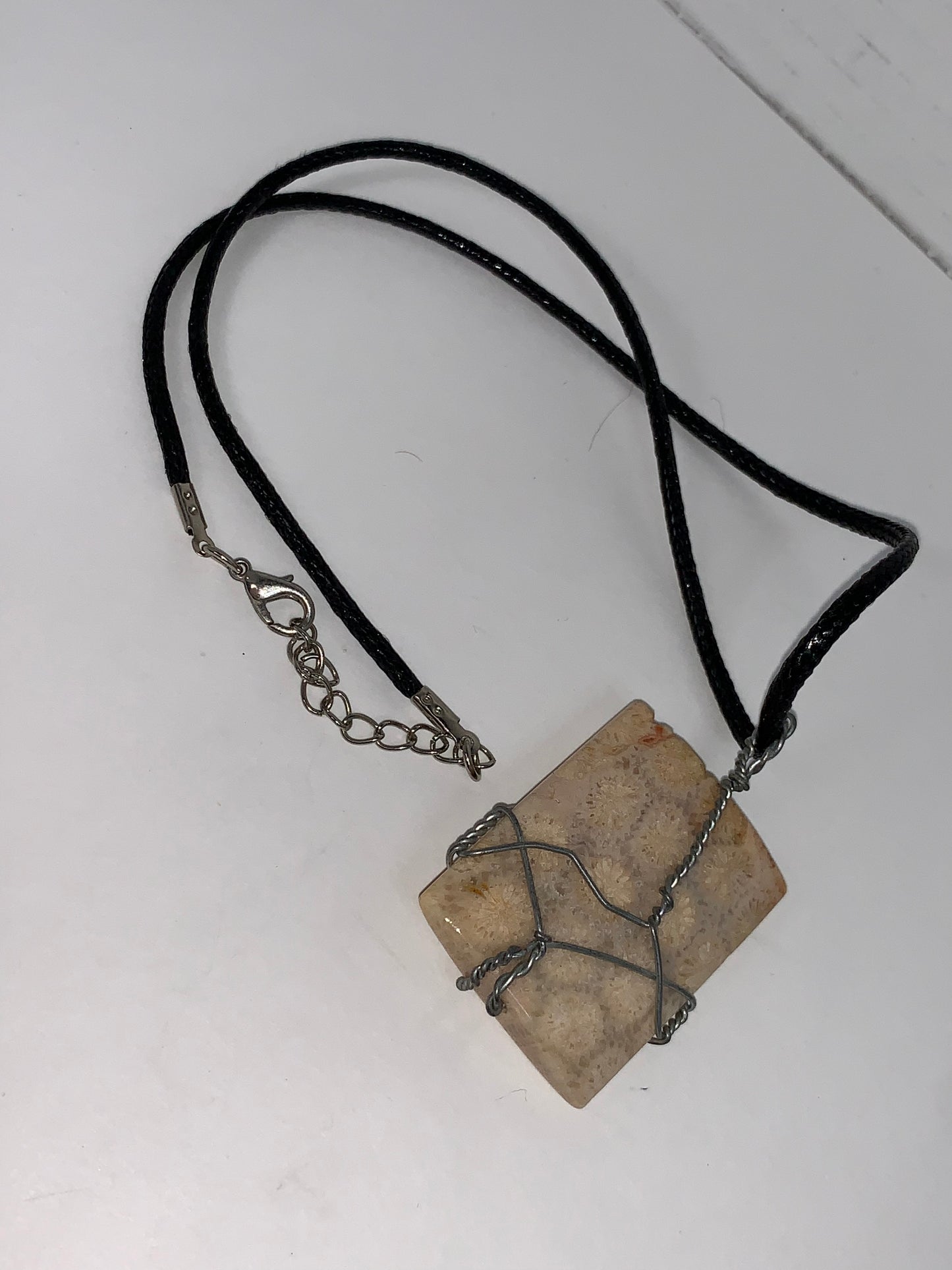 20" Braided Leather necklace with Wire wrapped Fossilized Coral Pendant