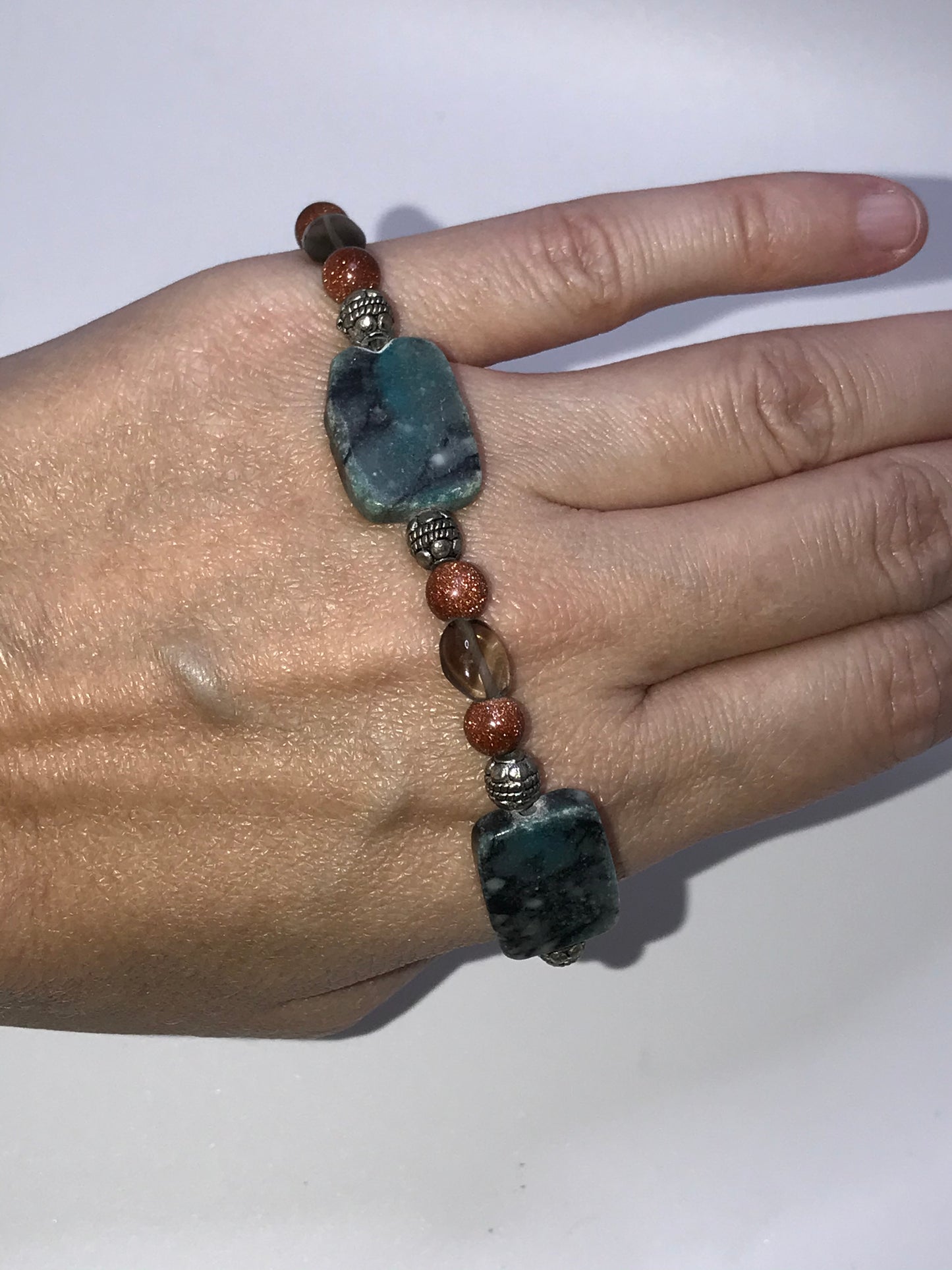 7" Marble, Gold Goldstone And Smoky Quartz Bracelet