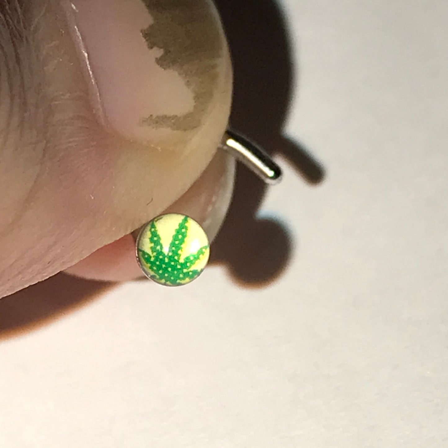 White with Green Pot Leaf 18 Gauge C-shaped Nose Ring