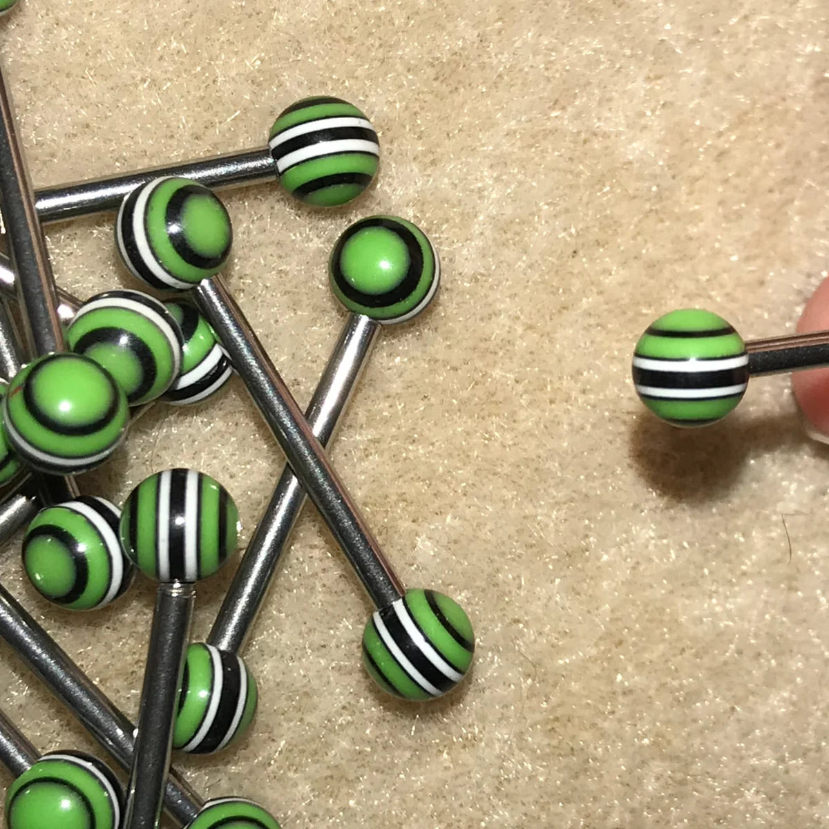 14 Gauge Black, green, and white striped design Tongue Rings