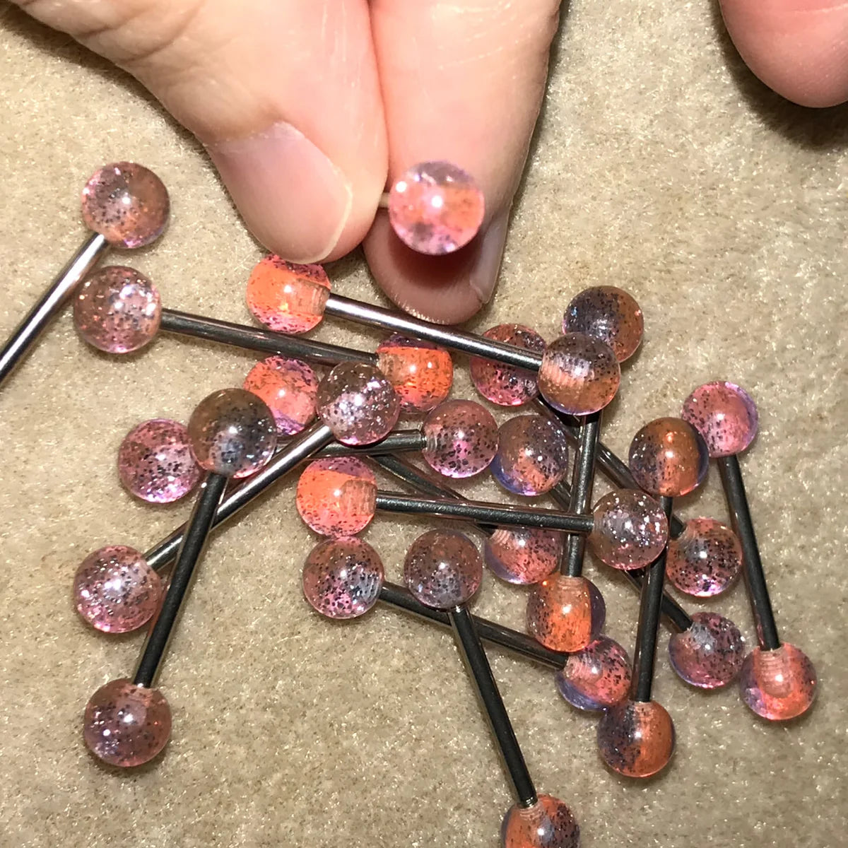 14 Gauge Pink, orange, and purple with silver glitter, stripe Design Tongue Ring.