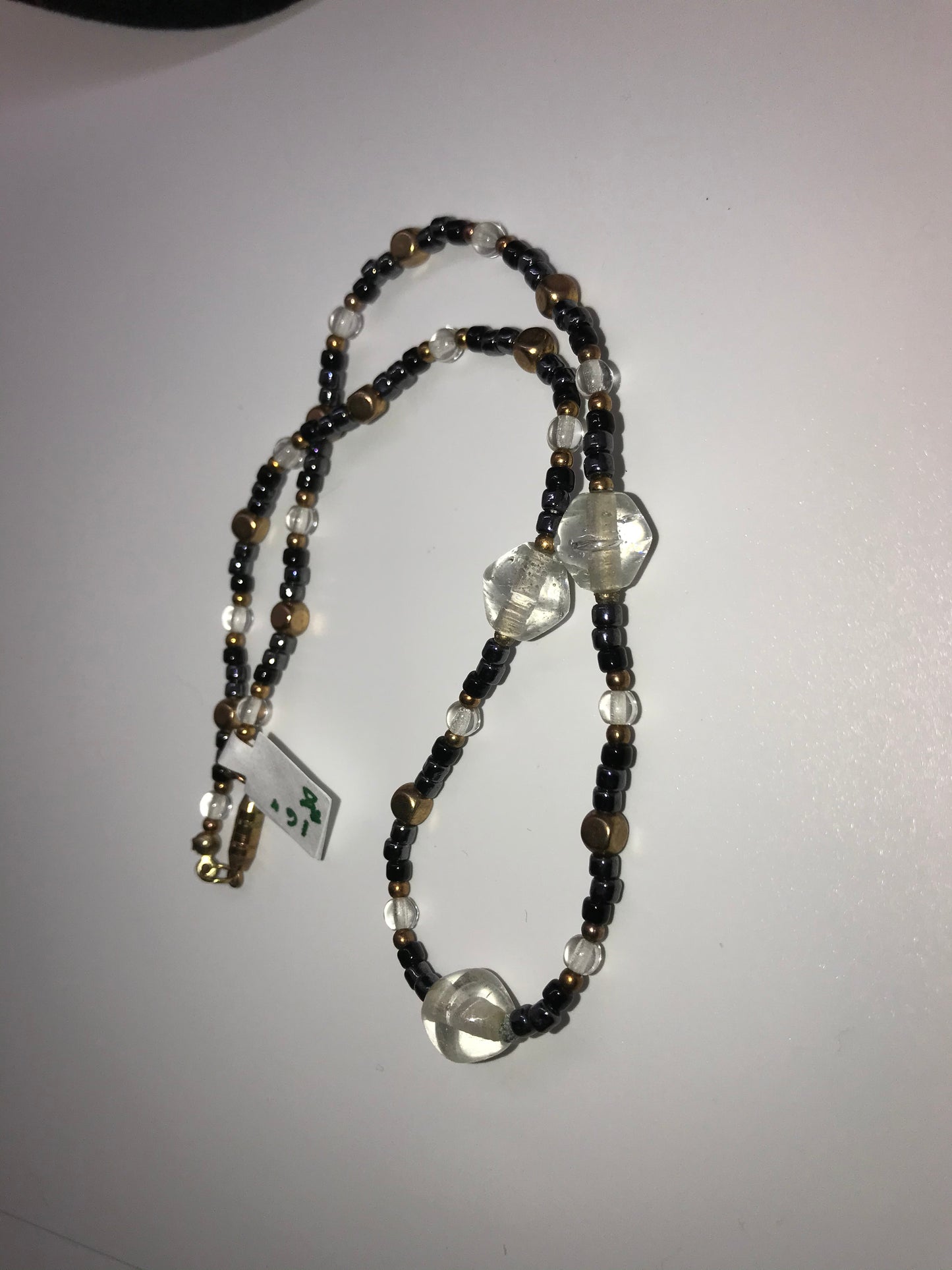 16" Black, Clear and Gold Beaded Necklace.