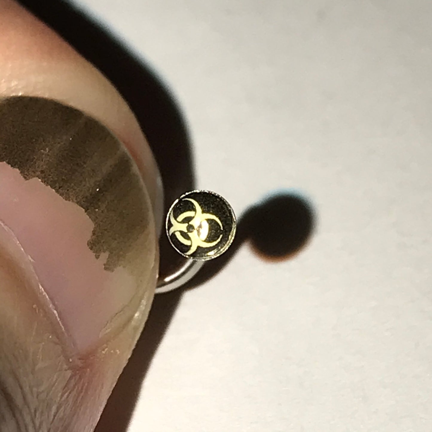 Black and White Biohazard 18 Gauge C-shaped Nose Ring