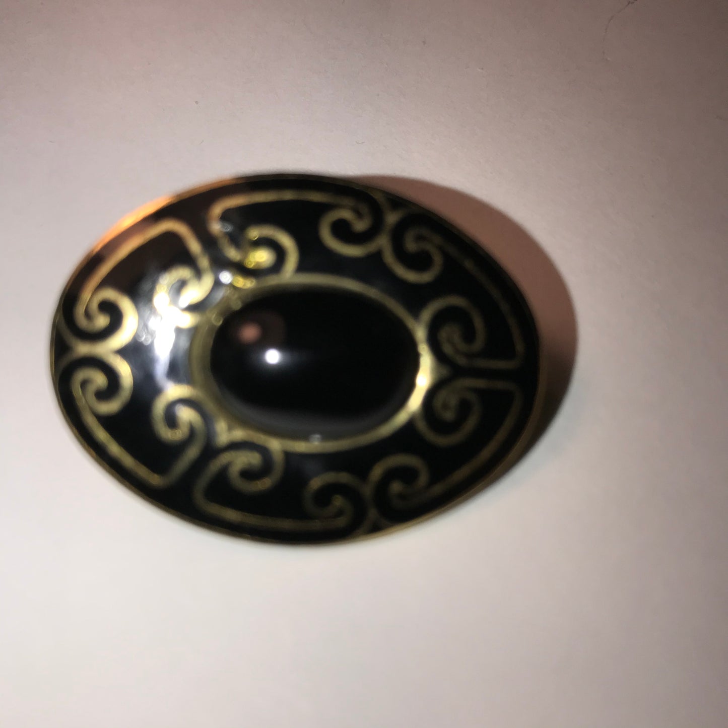 Black and gold Oval Mona So Pin