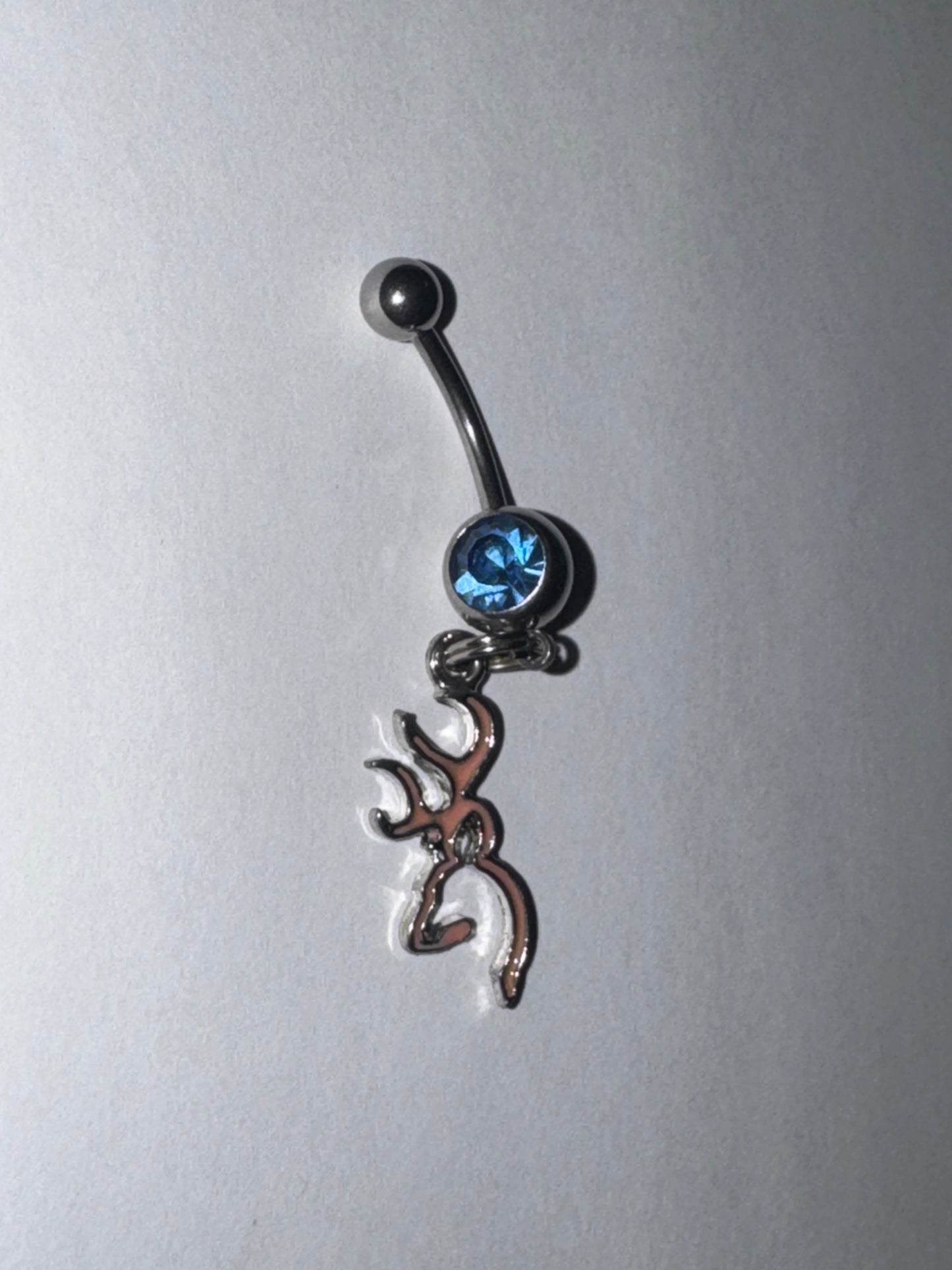Pink Browning Dangle Belly Ring with a Blue Gem