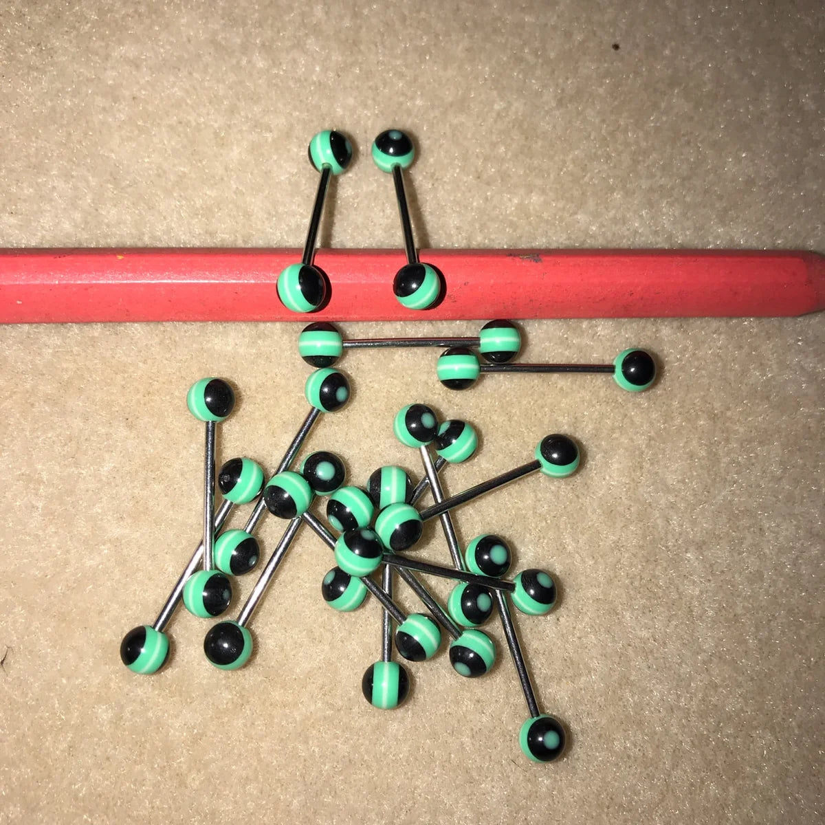 14 Gauge Black with green and white stripe design tongue ring
