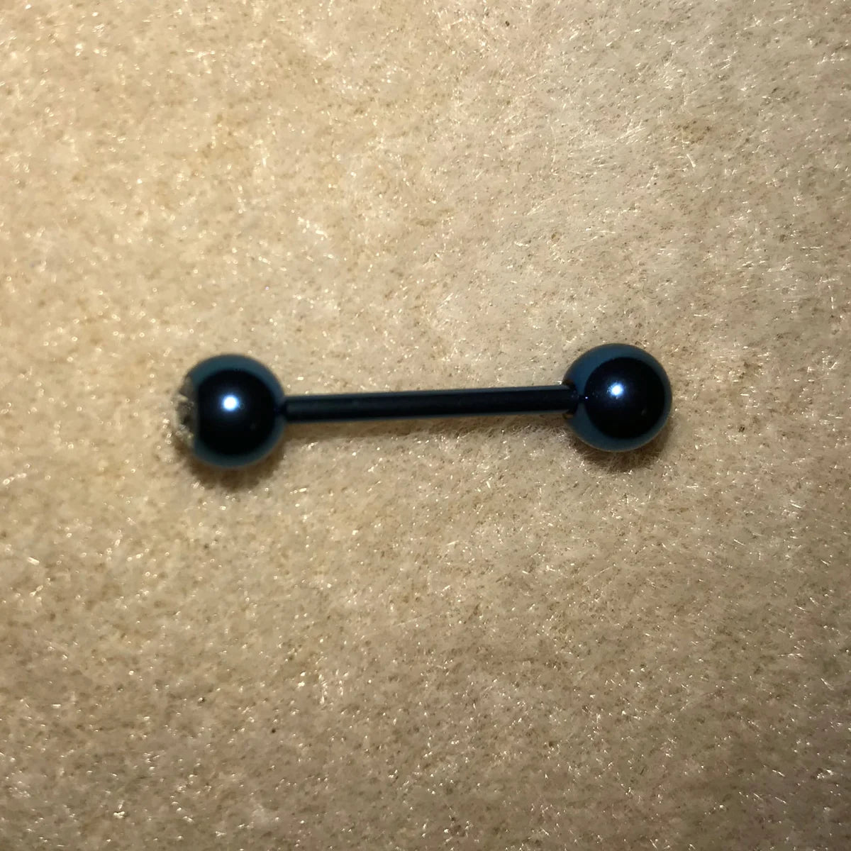 14 Gauge Blue with a Clear Gem Titanium Plated Tongue Ring