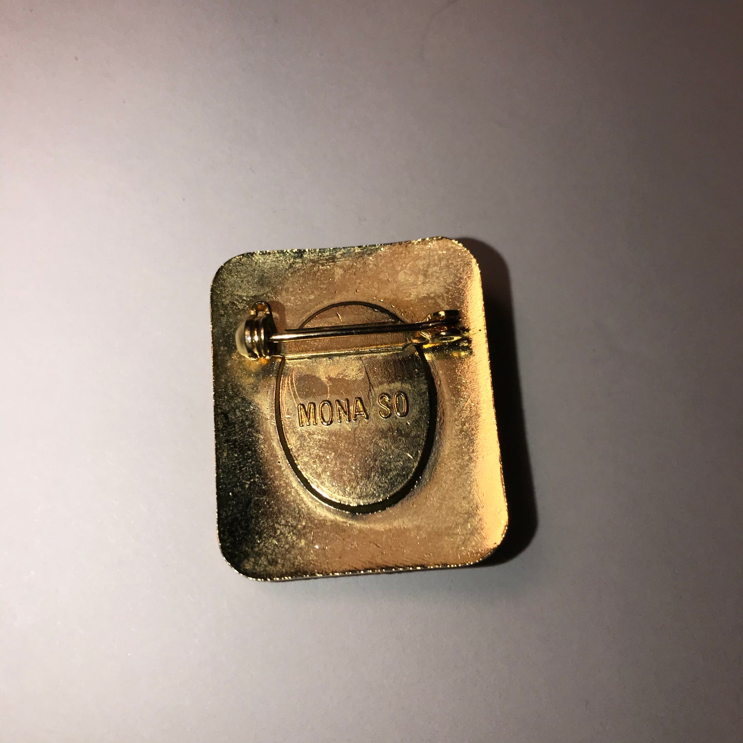 Rectangular Black and gold Mona So Pin